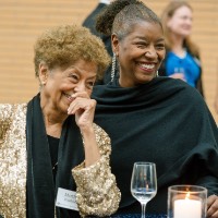 Martha Warfield and guests smiling during the reception